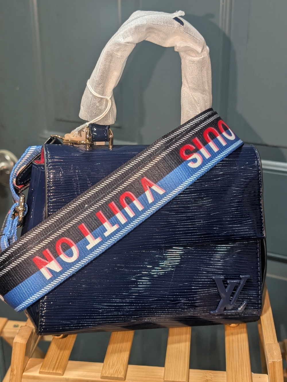 Fashion Inspired Navy Patent Epi Leather Messenger Bag with Logo Webbing Strap